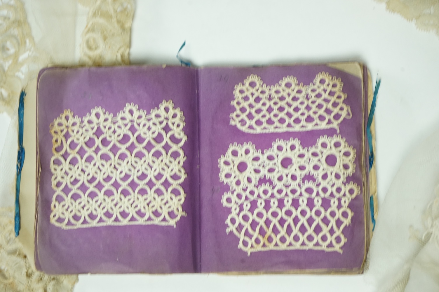 A Honiton lace wedding veil, (that has been cut into pieces), a Honiton edged collar, white worked jabot, various lace hankies etc. condition variable, very useful for theatre and film costume dramas.
